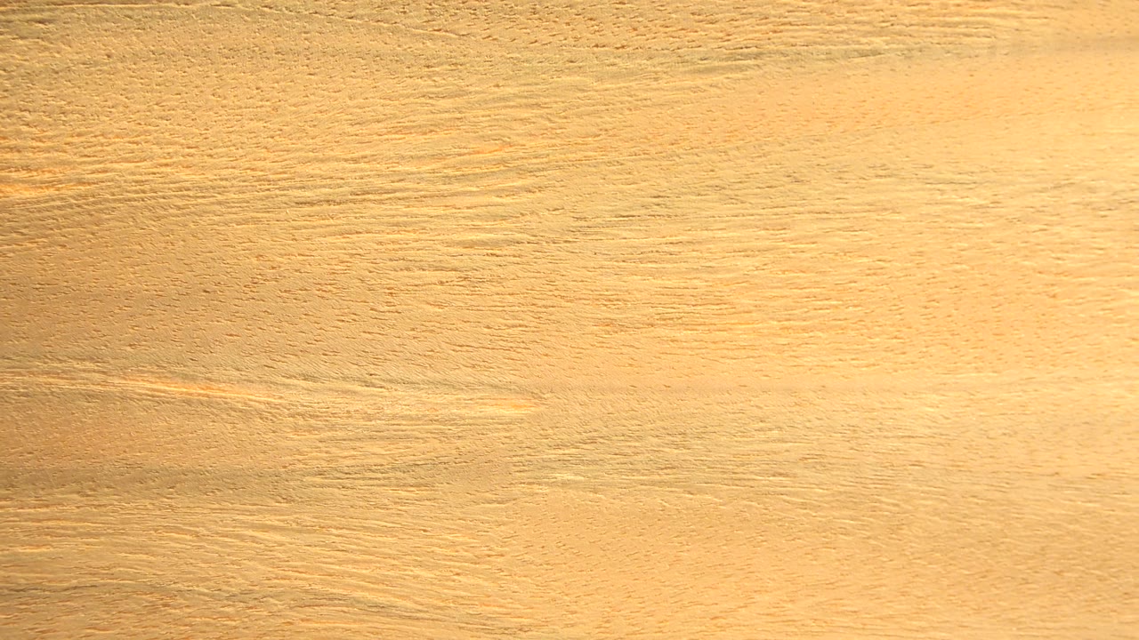Wood grain with a darker patch near the upper right