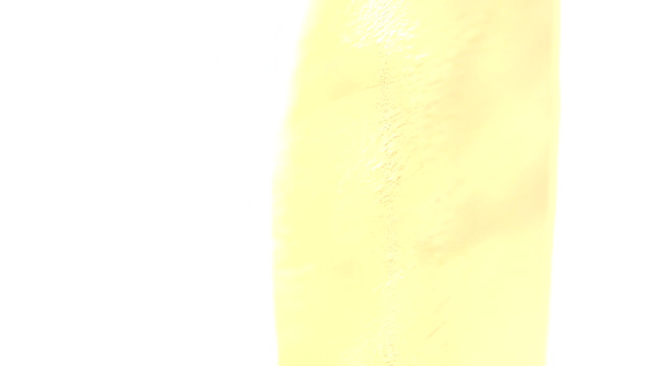 Golden textured surface with a pale blown highlight.