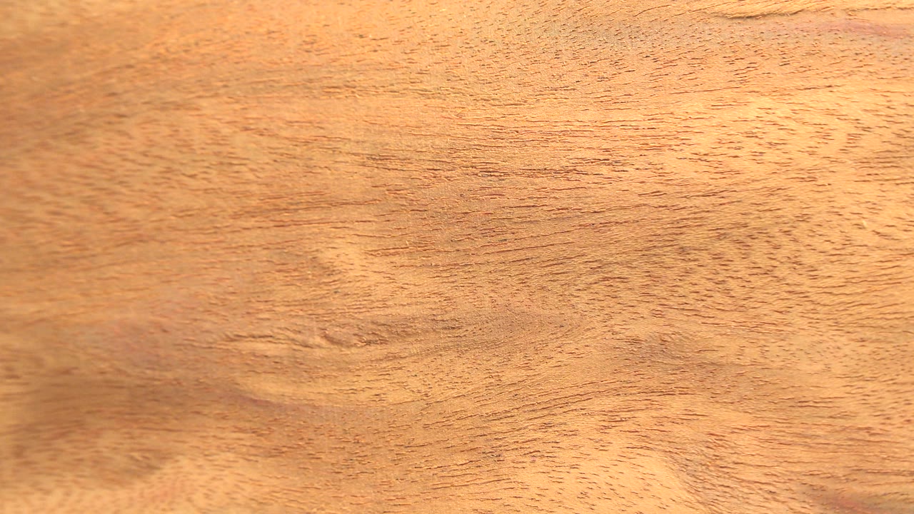 Close view of warm wood grain filling the frame.