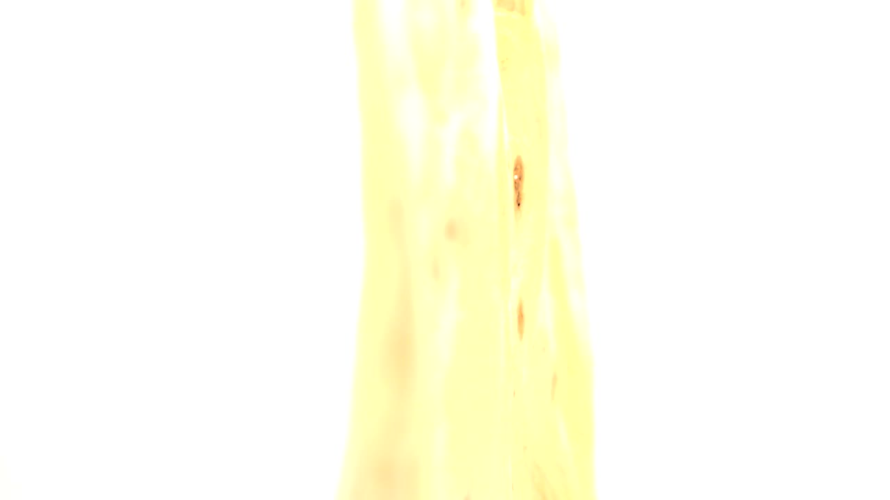 At 0:00, a blown-out white area fills most of the frame beside a vertical strip of amber wood grain in Westminster, Colorado, with no visible people.