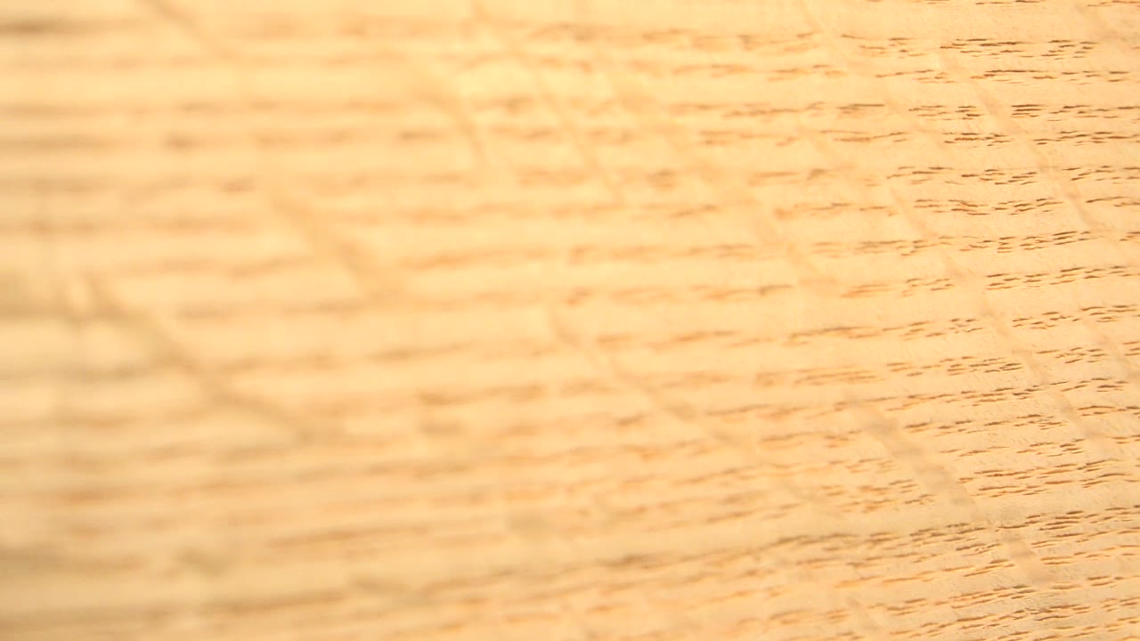 Tan wood surface with horizontal grain lines