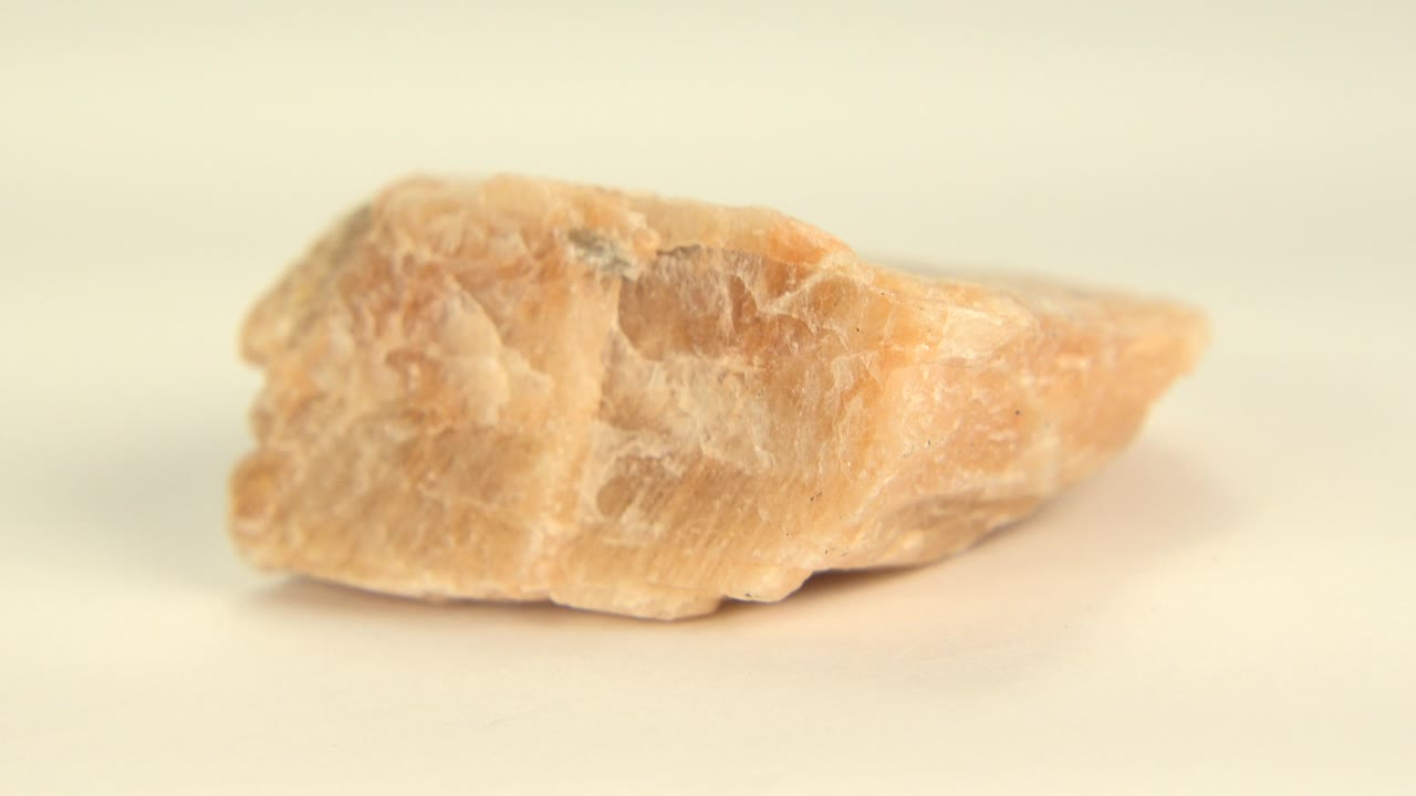 Rock close-up with a longer pointed right side.