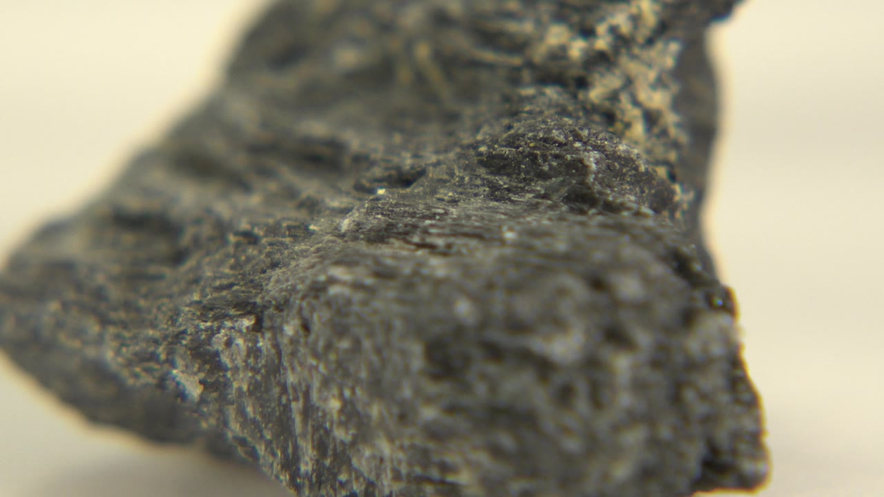 Macro view of a dark textured rock.