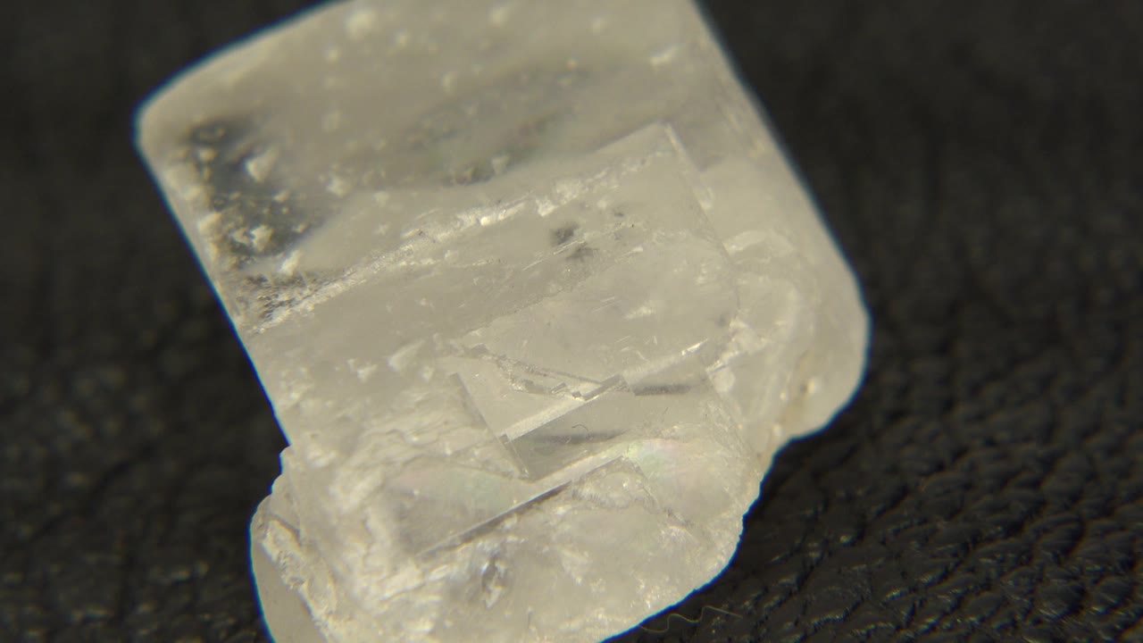 Angled quartz specimen with visible internal cracks.