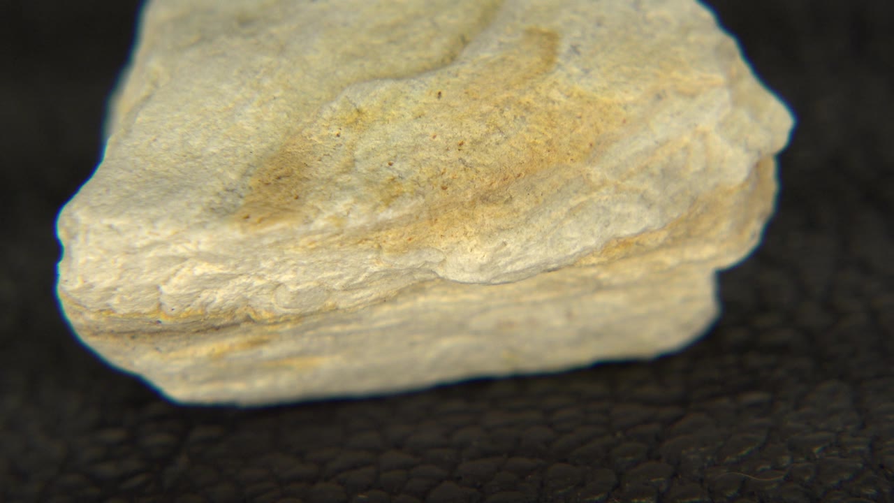 Pale rock turned to show a more squared front edge.