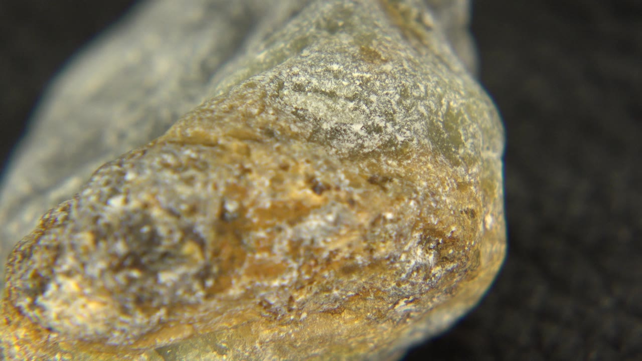 Close-up of a rounded stone point with rough crust