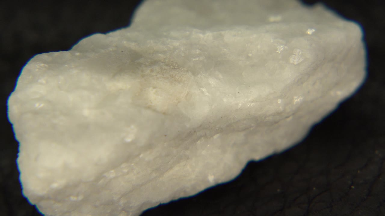 White rock angled with one end closer to camera.