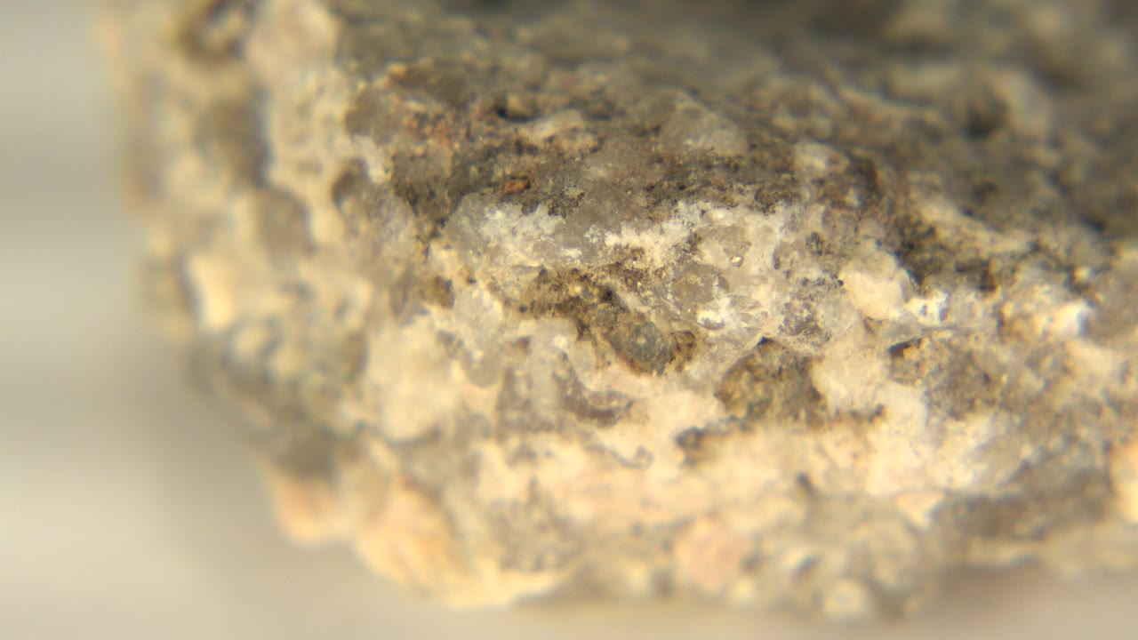 Soft-focus close-up of a craggy rock face.