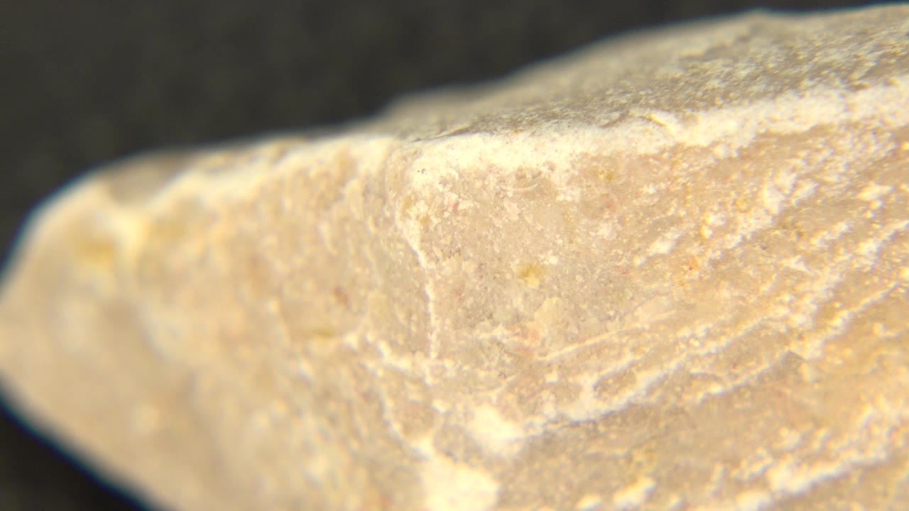 Extreme close view of the rock corner and chalky texture.