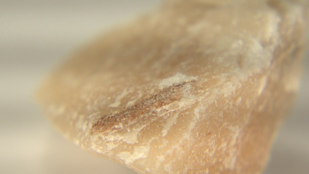 Angled close-up of the rock with its pointed side turning into view.
