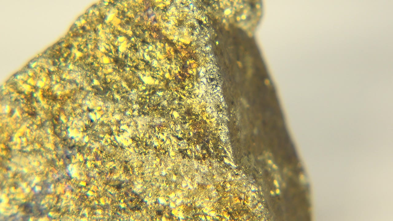 Gold-colored stone corner in shallow focus