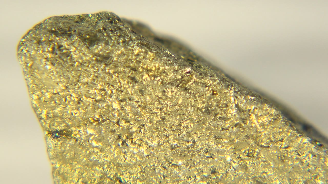 Angled close-up of a gold-colored nugget tip.
