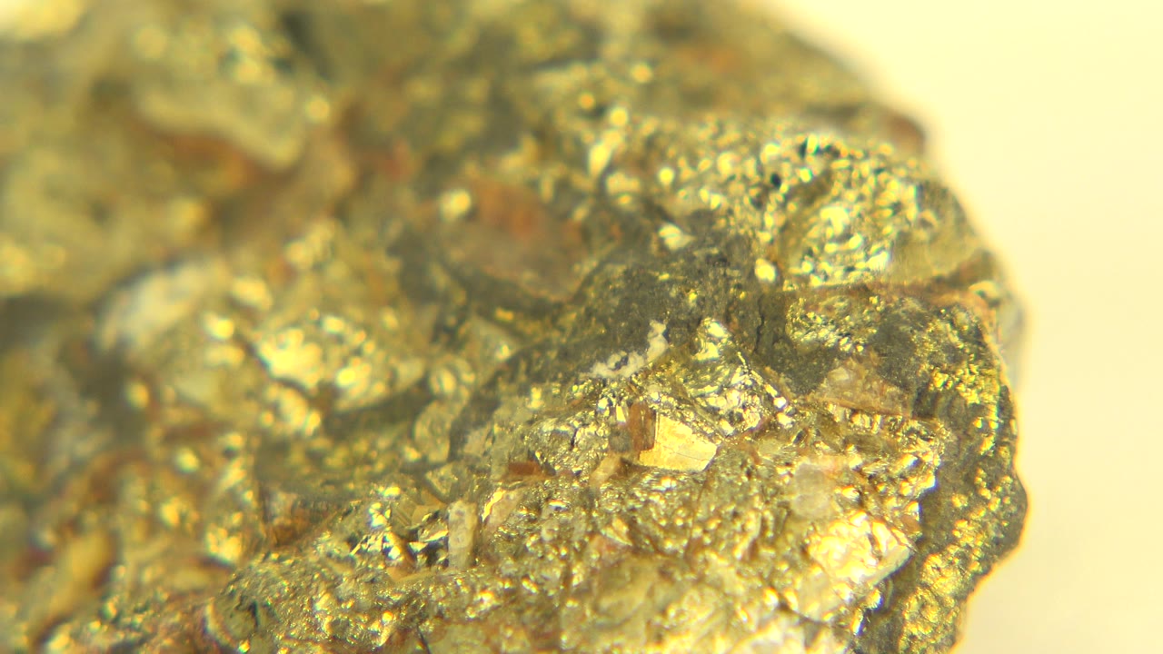 Macro view of the same sparkling rock in Westminster, Colorado, with bright flecks catching light near the center and no visible people.