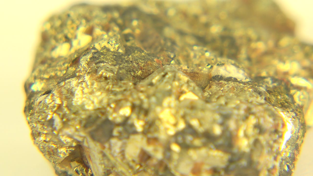 Bright jagged gold-colored piece with sparkling facets.