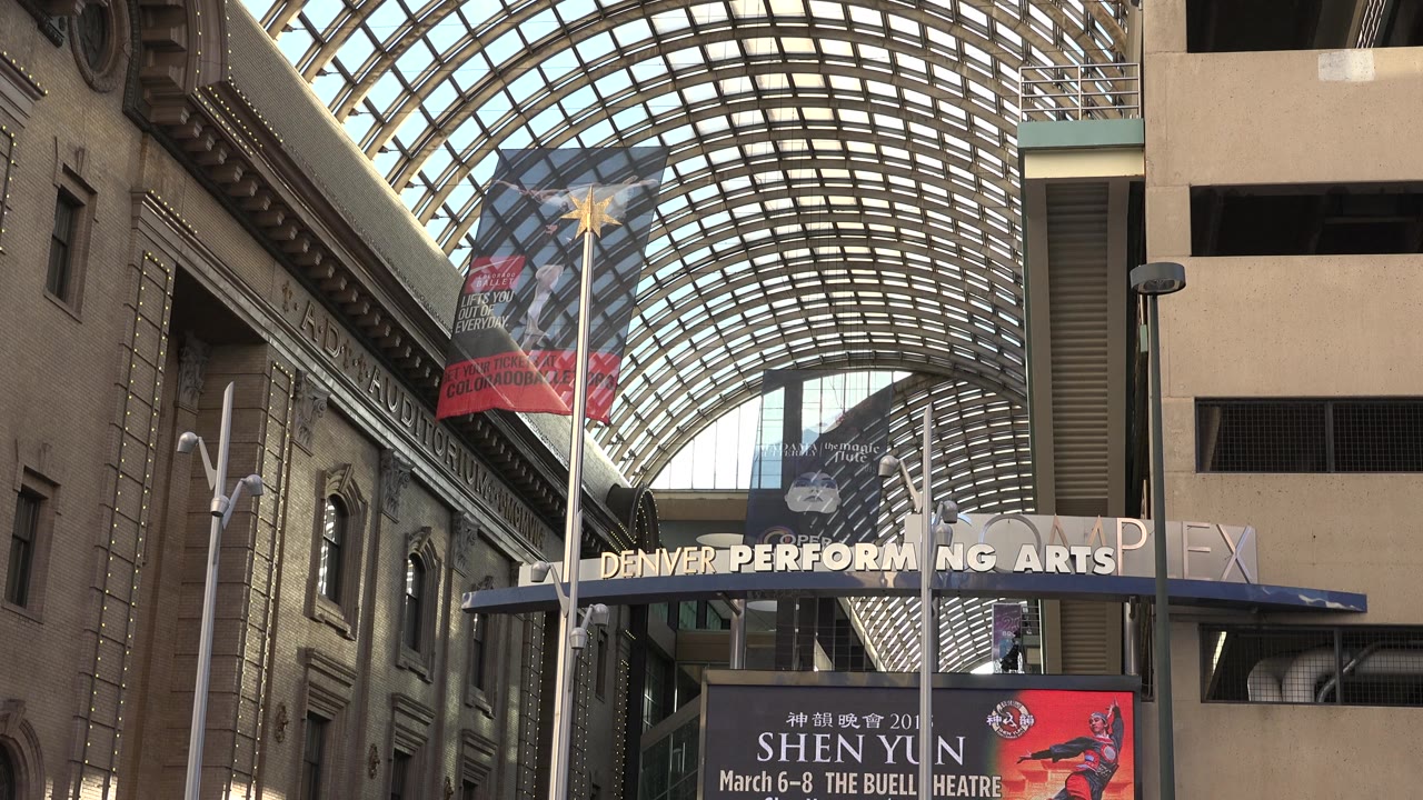 Arched glass roof and Denver Performing Arts sign.