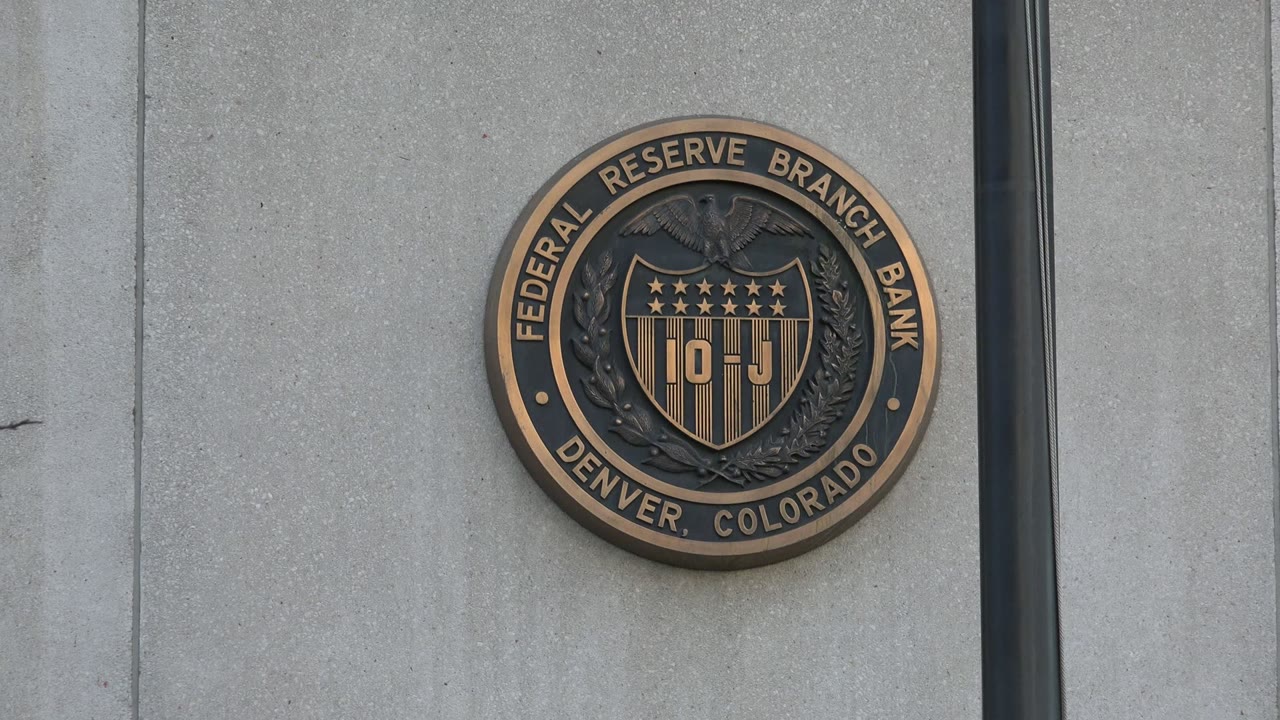 Federal Reserve Branch Bank seal on a concrete building wall.