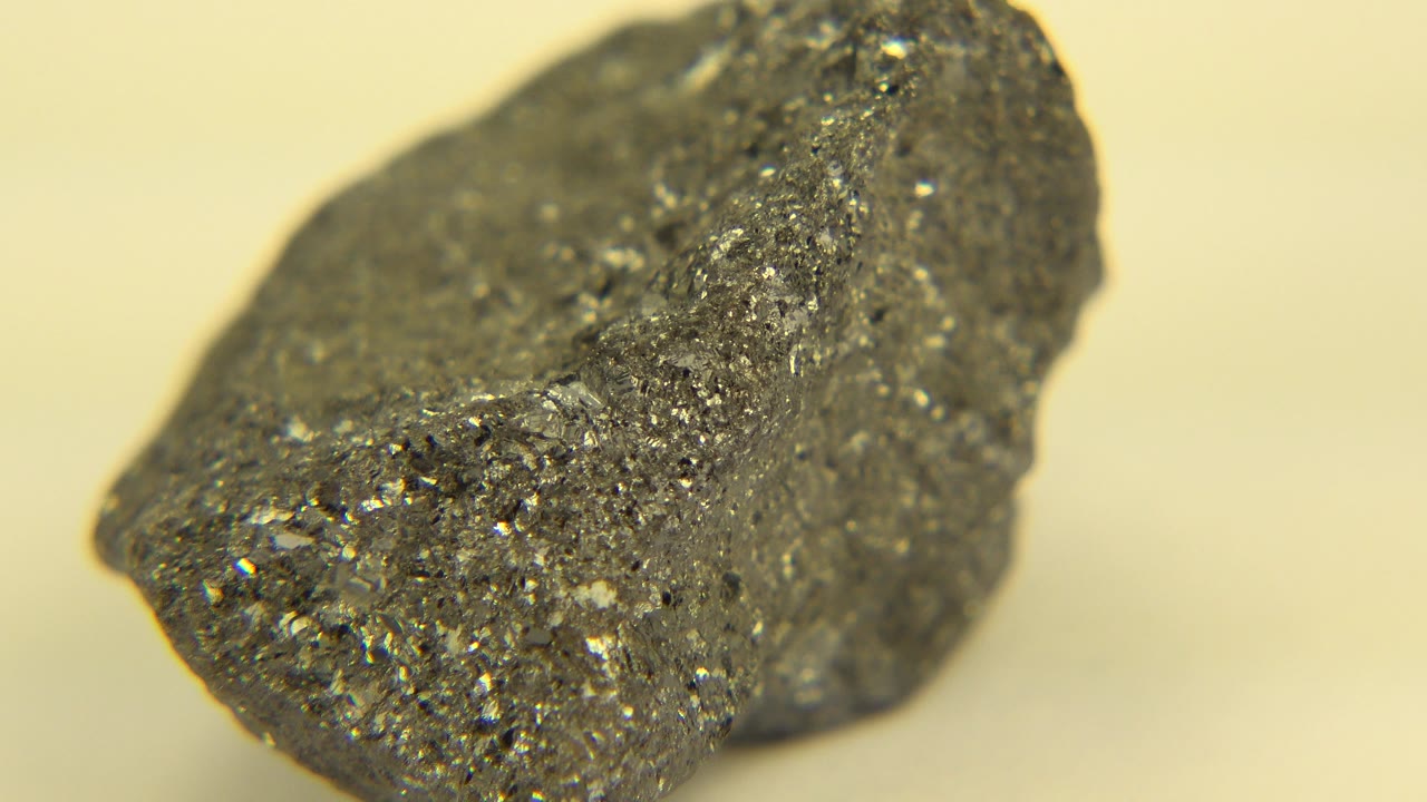 Rock close-up seen from another angle with a dark porous surface.