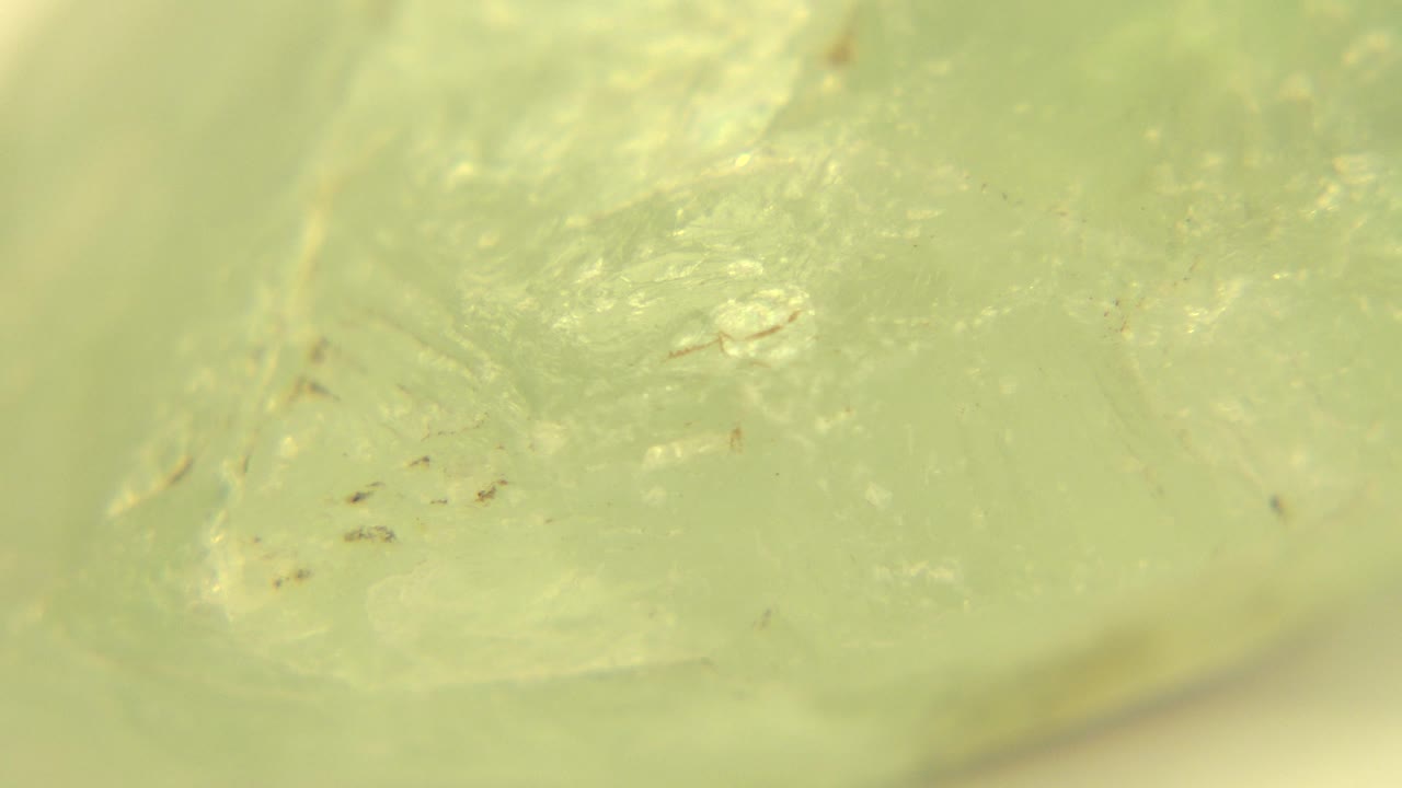 Close-up rock face with pale green facets