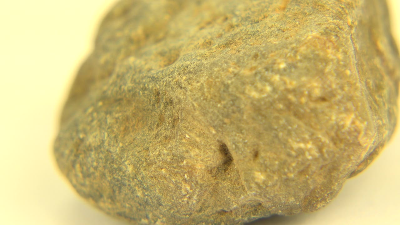 The stone remains close to camera in Westminster, Colorado, with a small dark indentation near the lower middle and no visible people.
