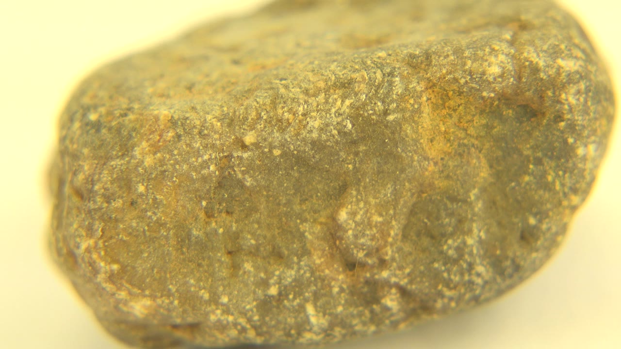 Mineral rock shifted to reveal a different rounded end.