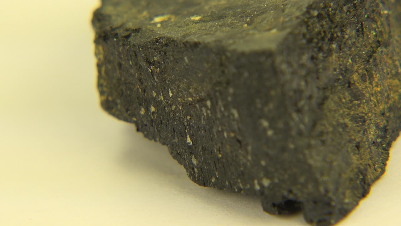 Angled close-up of a black and yellow rock corner.