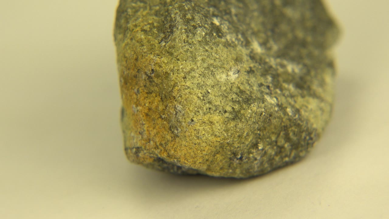 Stone face turned slightly with darker upper surface