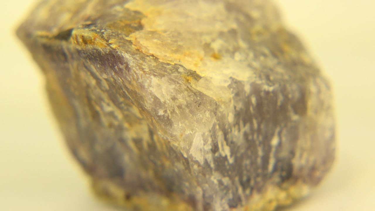 A close-up view of the same stone in Westminster, Colorado shows more of the angled top surface and mottled gray mineral face, with no visible people.