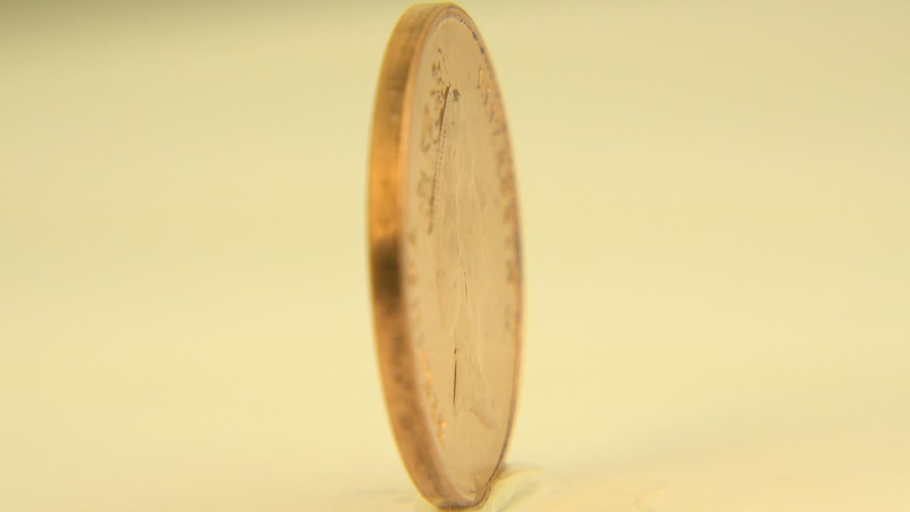 British one-pound coin beginning to face camera