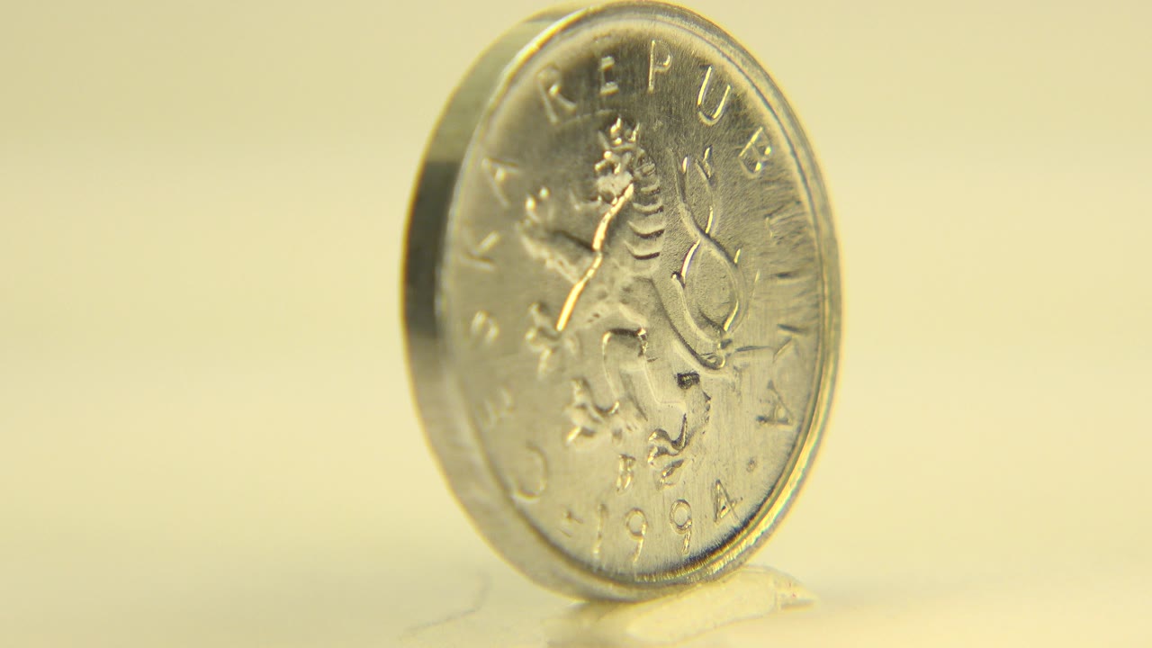 Angled macro view of a 1994 Czech Republic coin in Westminster, Colorado, with warm yellow light, shallow focus, and no visible people.