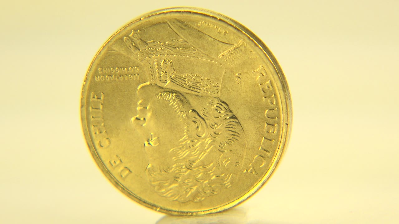 Gold coin upright with face turned slightly