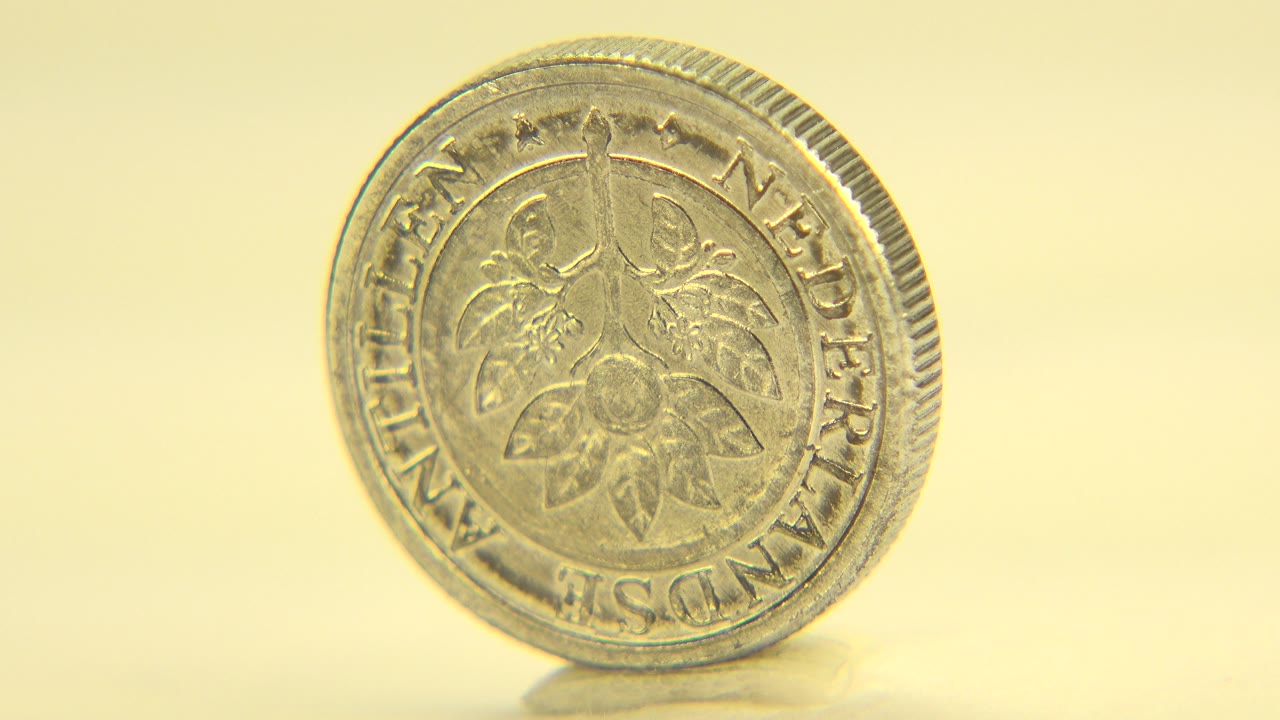 Coin angled slightly with its ridged edge visible.