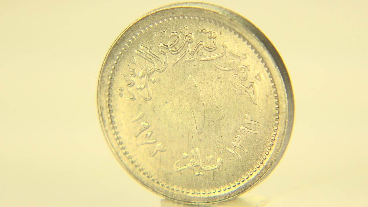 Coin face angled slightly with brighter highlights.