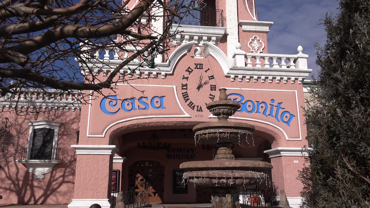 Casa Bonita facade with fountain and tree branches