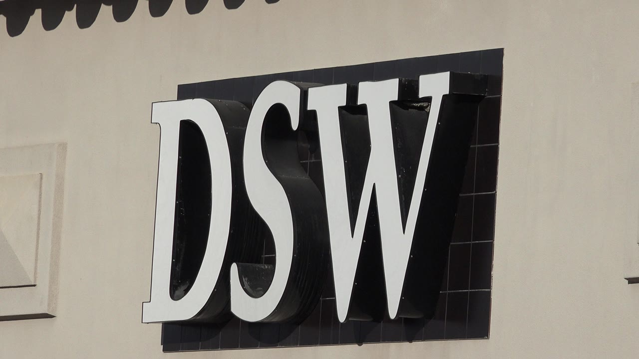 Large DSW sign on a light building facade