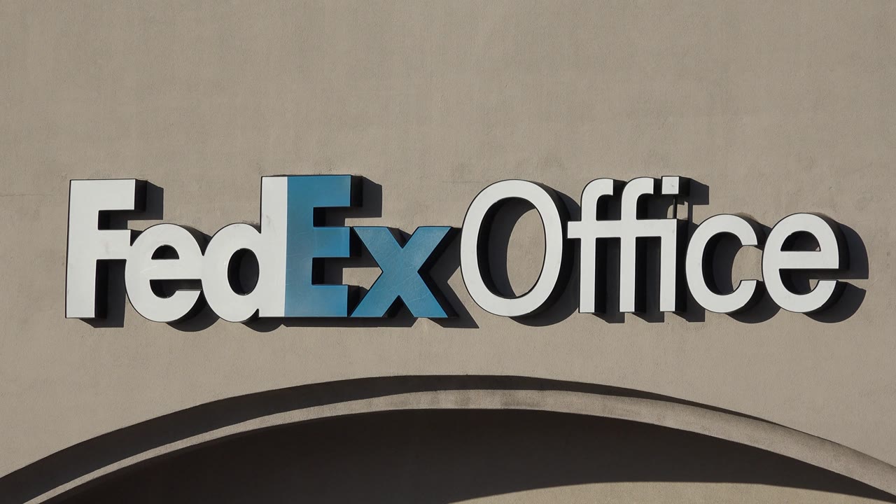 Angled close view of FedEx Office storefront sign
