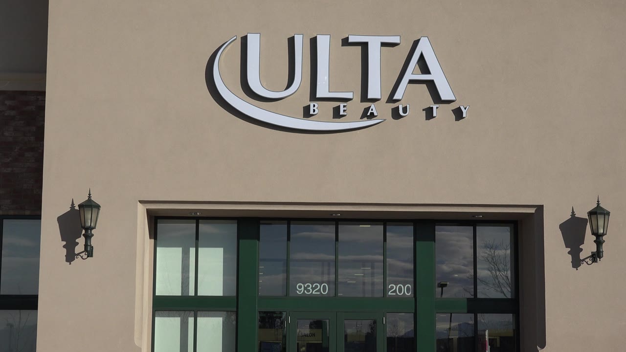 Close view of Ulta Beauty signage above a storefront entrance.