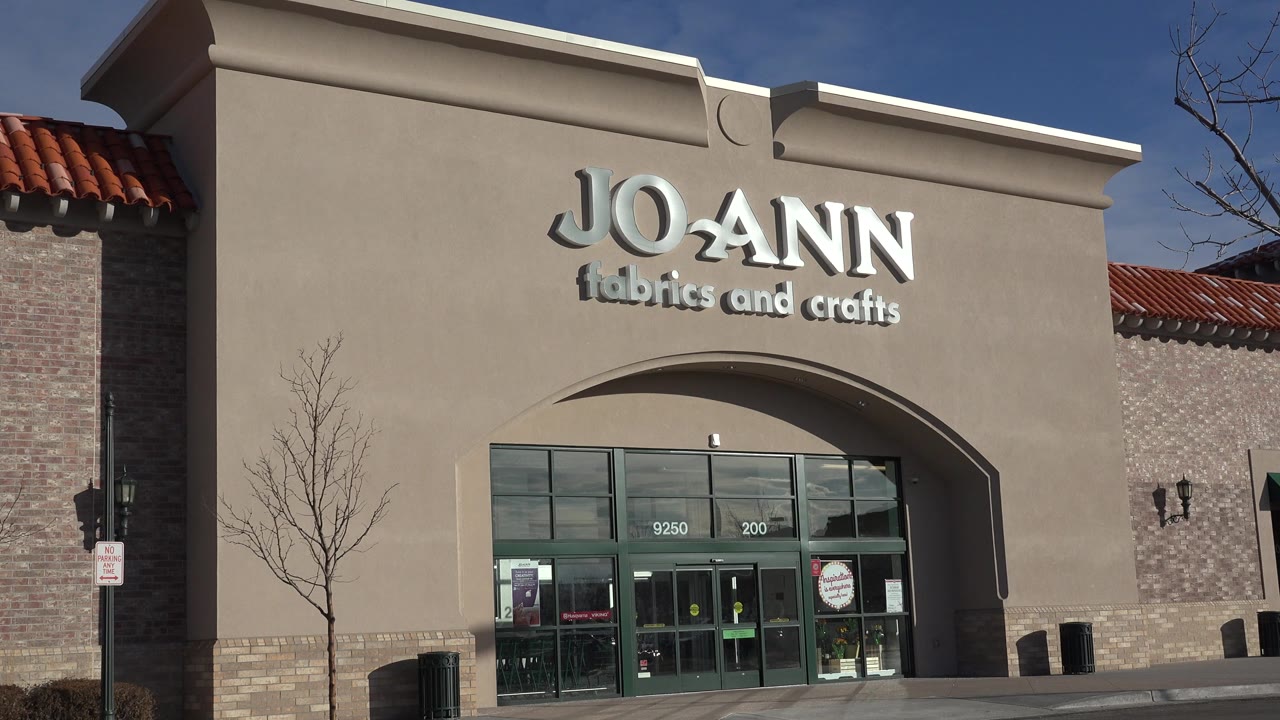 JOANN fabrics and crafts storefront under blue sky
