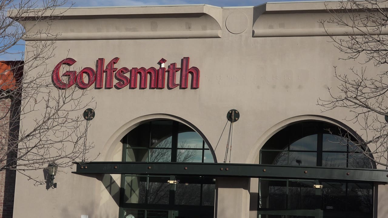 Goldsmith storefront sign above arched windows and entrance canopy.