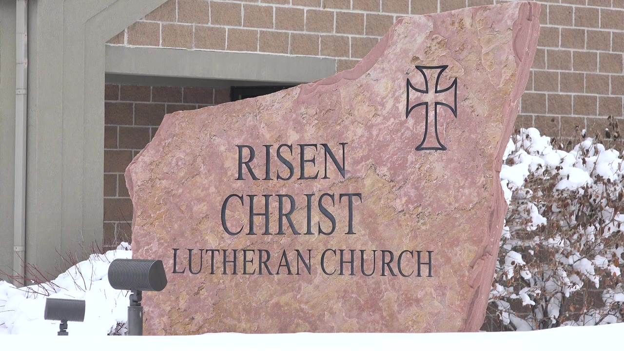 Close view of Risen Christ Lutheran Church sign in snow