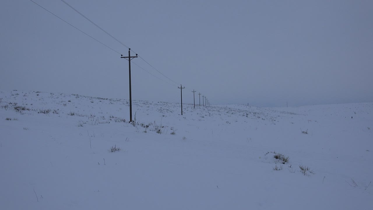 Second frame shows the Arvada, Colorado winter field with the main pole left of center, smaller poles in the distance, and no visible people.
