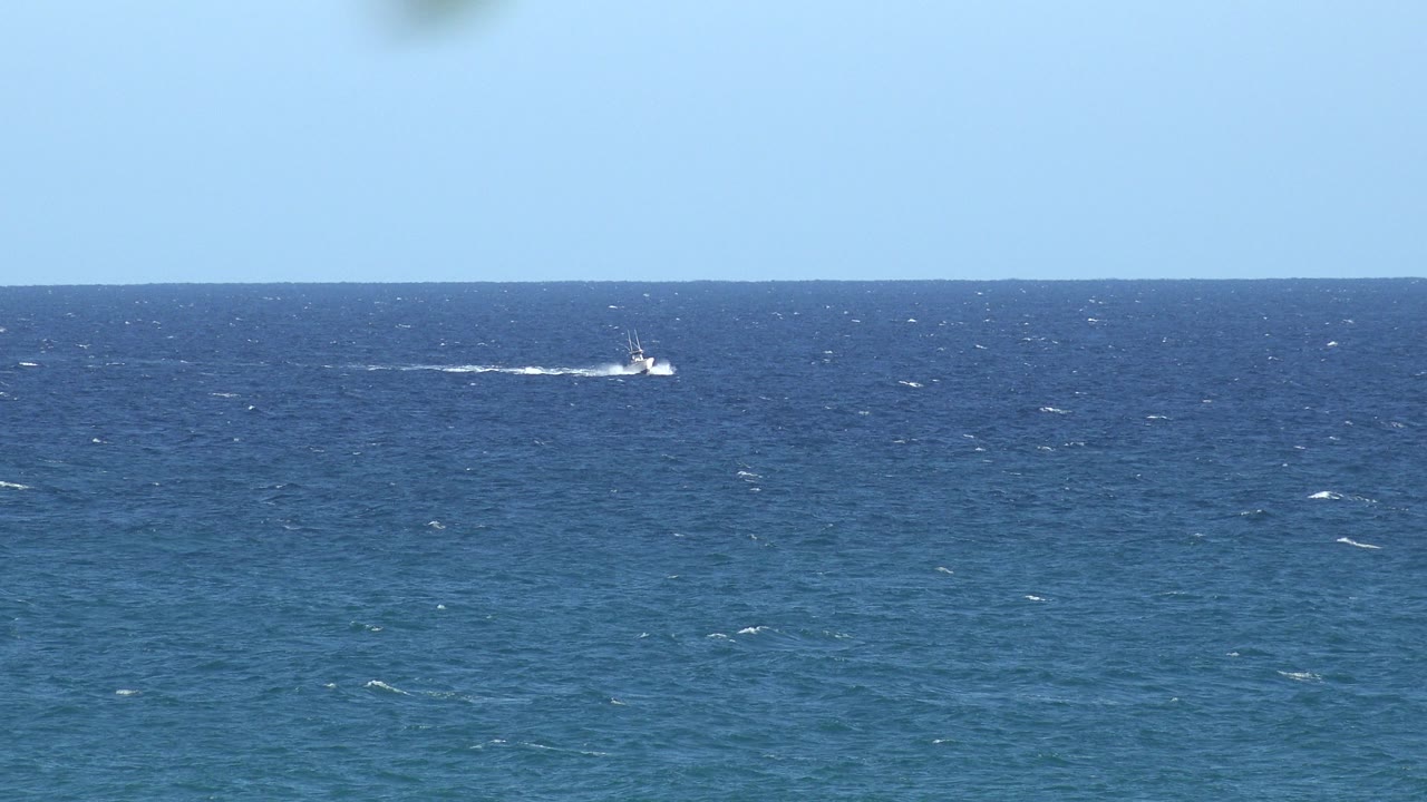 Open choppy ocean from the Grand Junction, Colorado 2017 collection, with a small white wake near the horizon and no visible people.