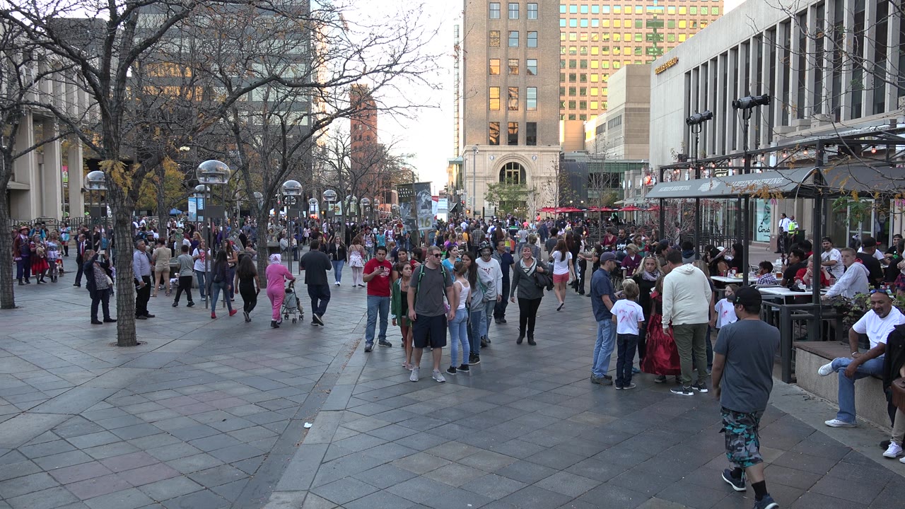 Families and pedestrians in a downtown plaza