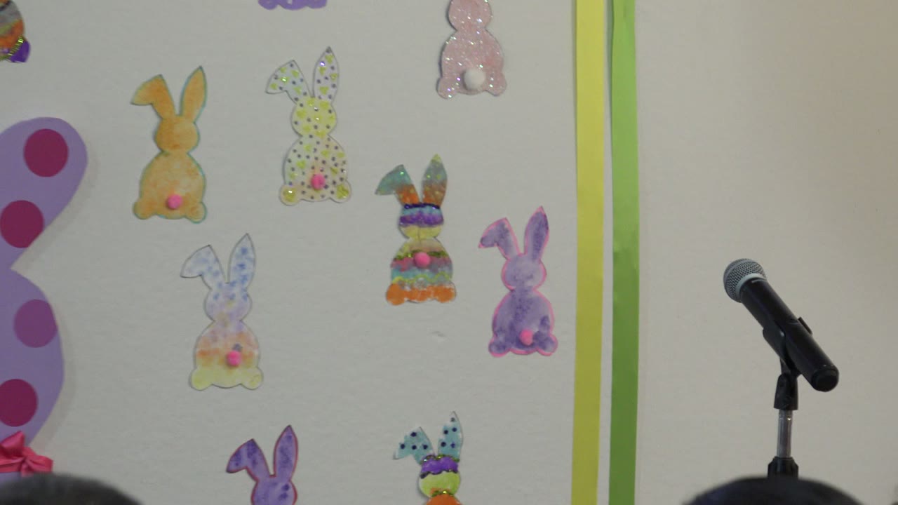 Microphone and colorful rabbit artwork on an indoor wall