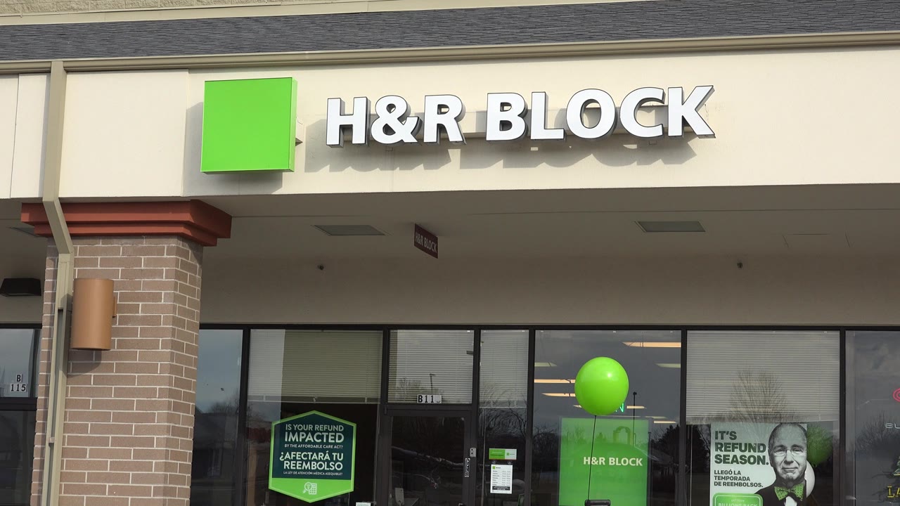 Closer view of H&R Block facade with balloon in window.