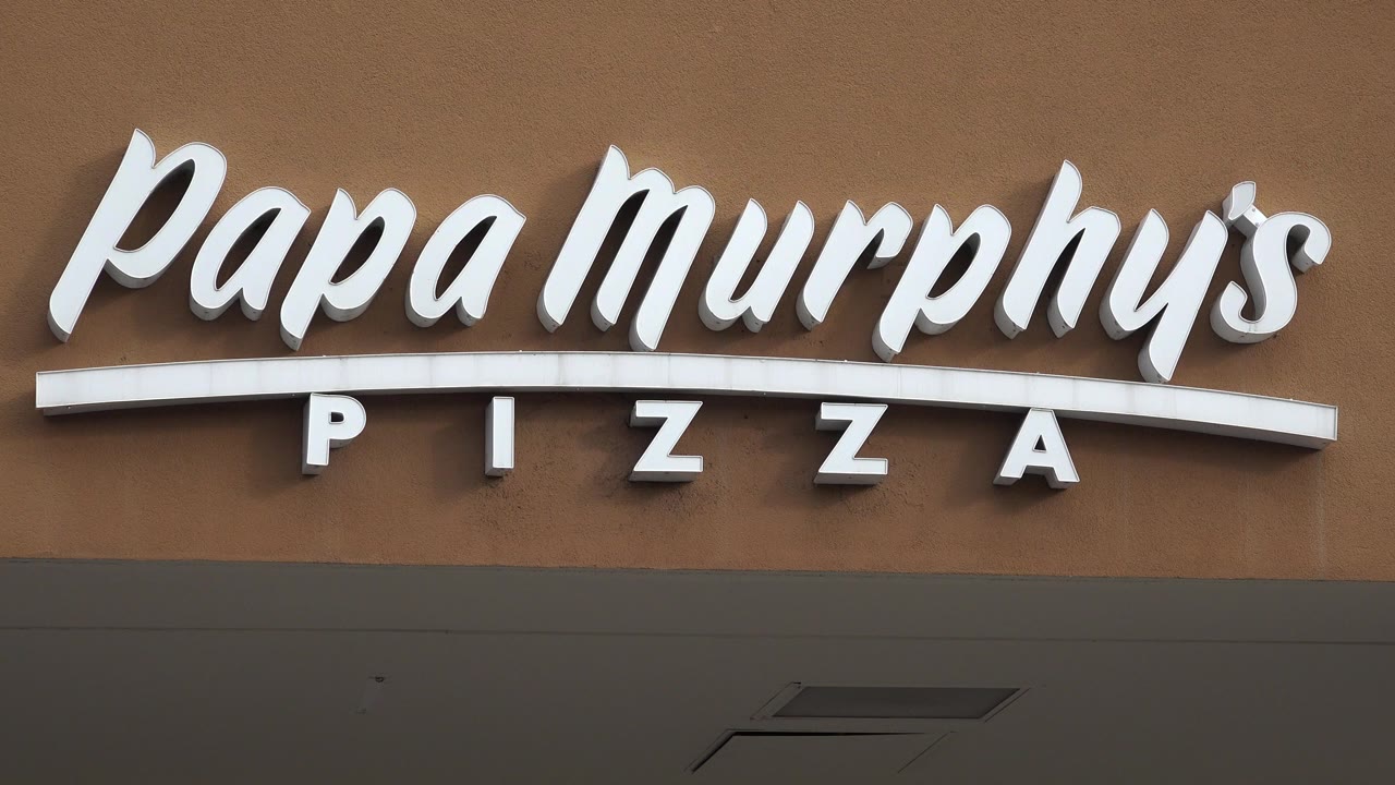 Papa Murphy's Pizza sign on a tan storefront wall