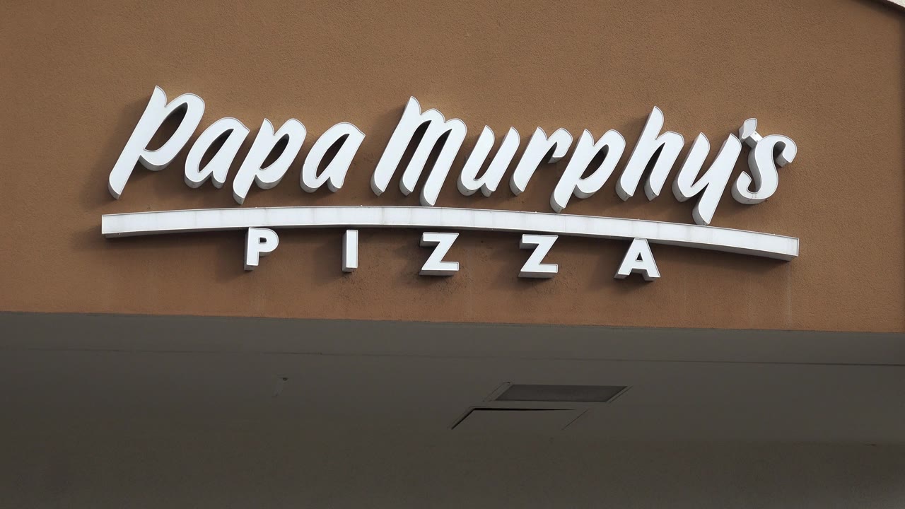 Papa Murphy's Pizza sign on a storefront facade.