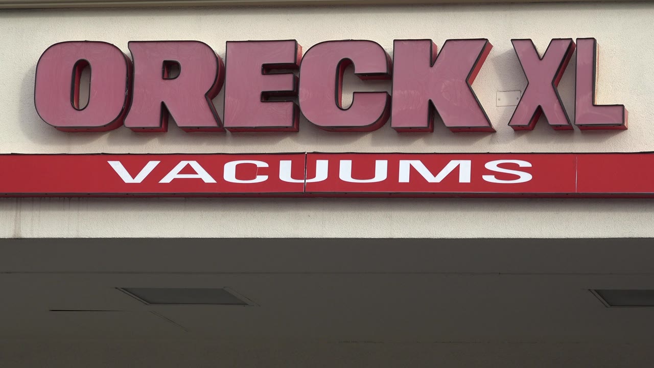 Storefront sign reading Oreck XL Vacuums