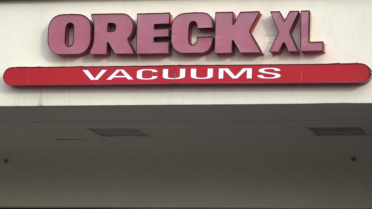 Oreck XL Vacuums sign with rounded red sign bar.