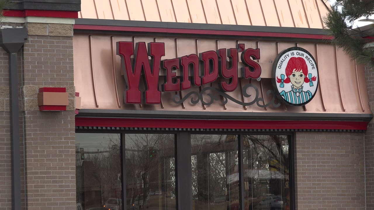 A tight facade view in Westminster, Colorado centers the Wendy's lettering and round logo over reflective windows, with no visible people.