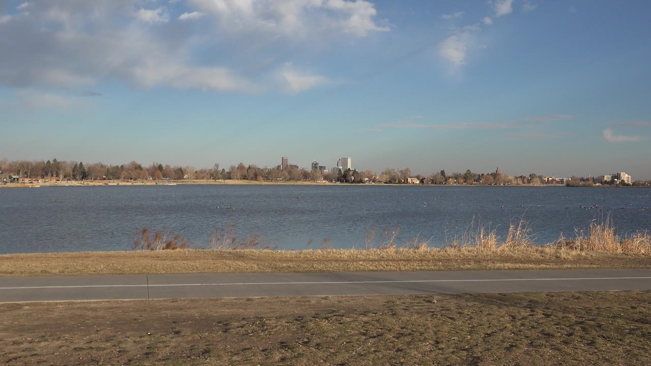 Wide lakeside path with no visible people